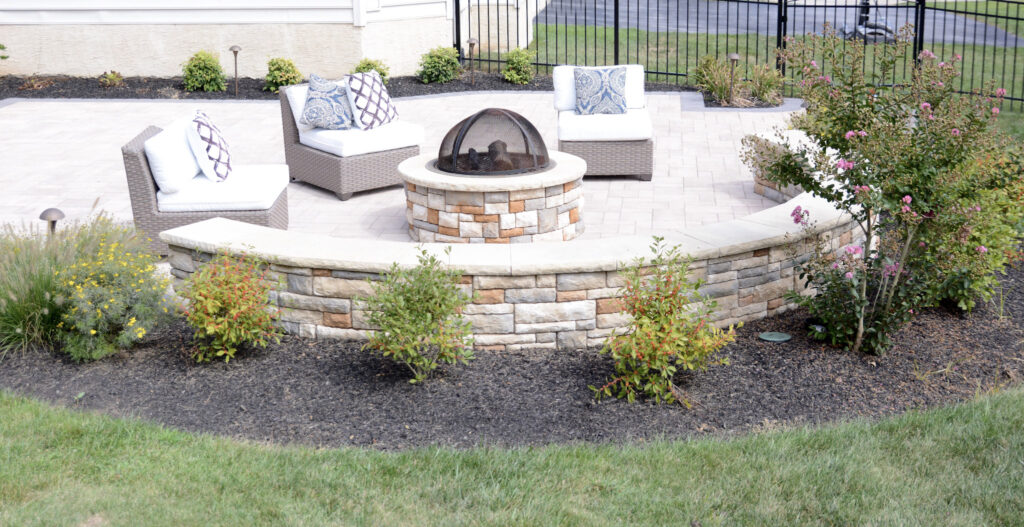15-cast stone fire pit and curved stone wall installation